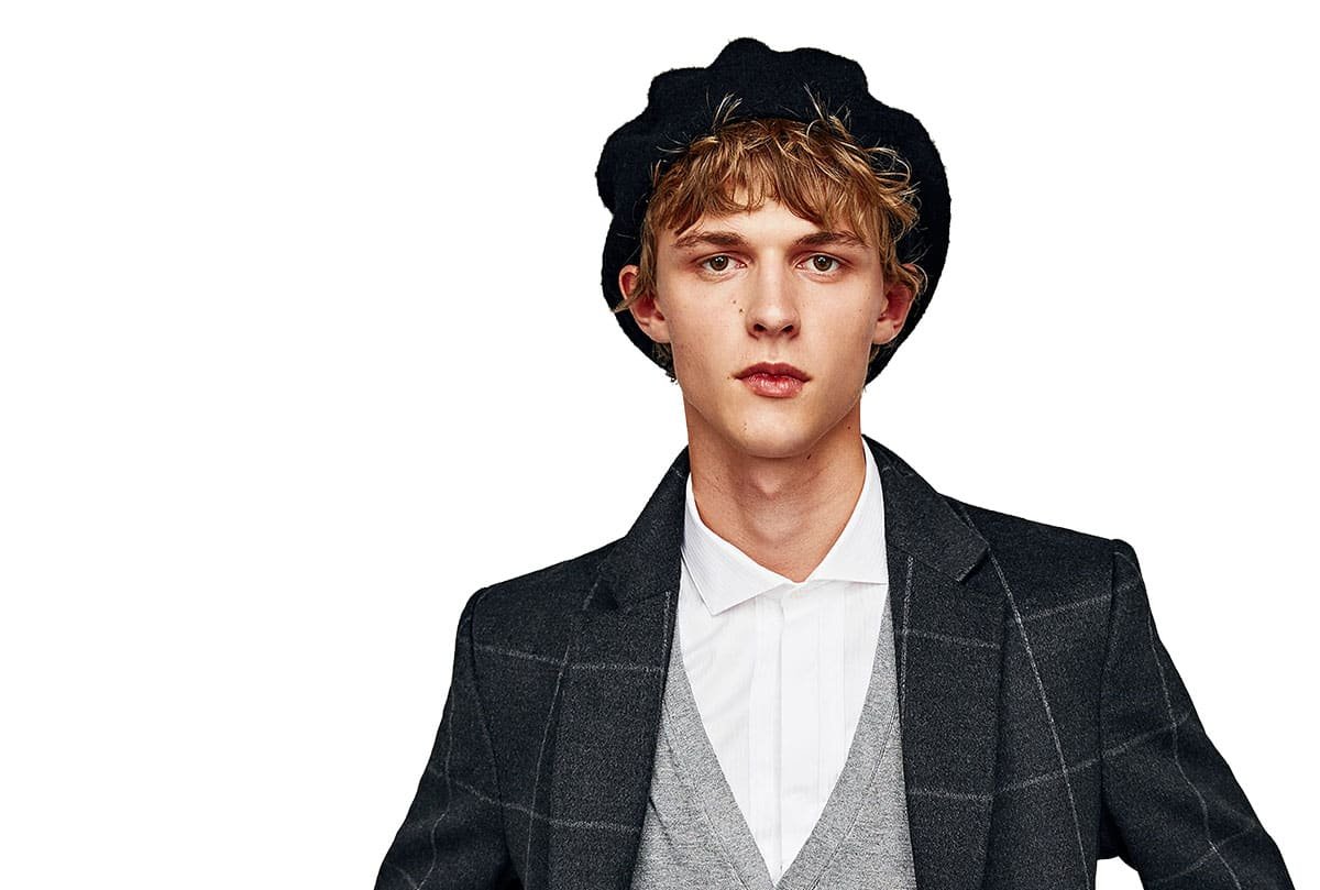 Model wearing a grey check blazer from the tailoring collection
